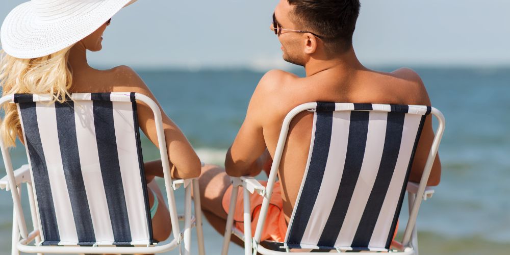 Couple Sunbathing Beach