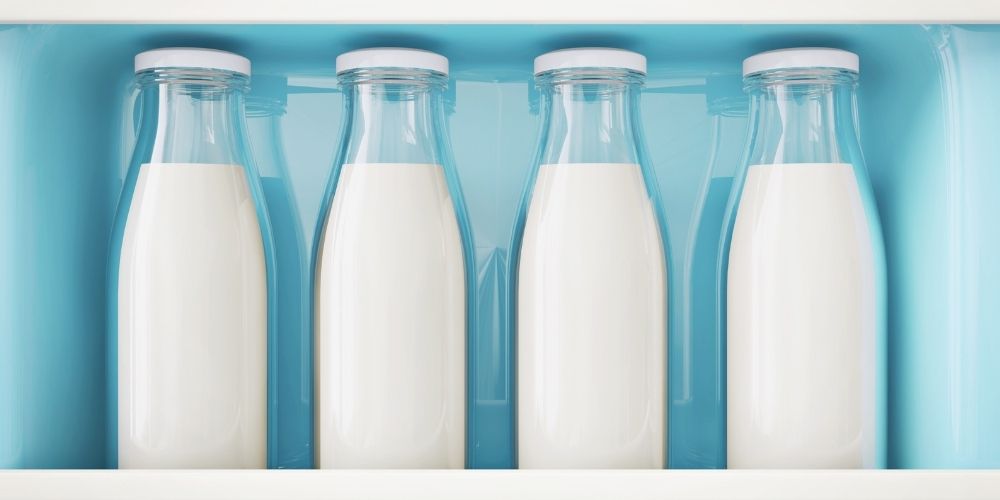 Milk Bottles in Refrigerator 