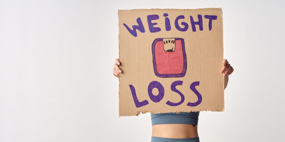 Person-Cardboard-Weight-Loss-Message.jpg