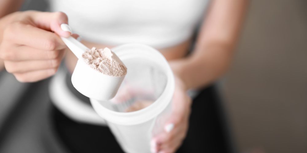 Sport-Young-Woman-Protein-Powder.jpg