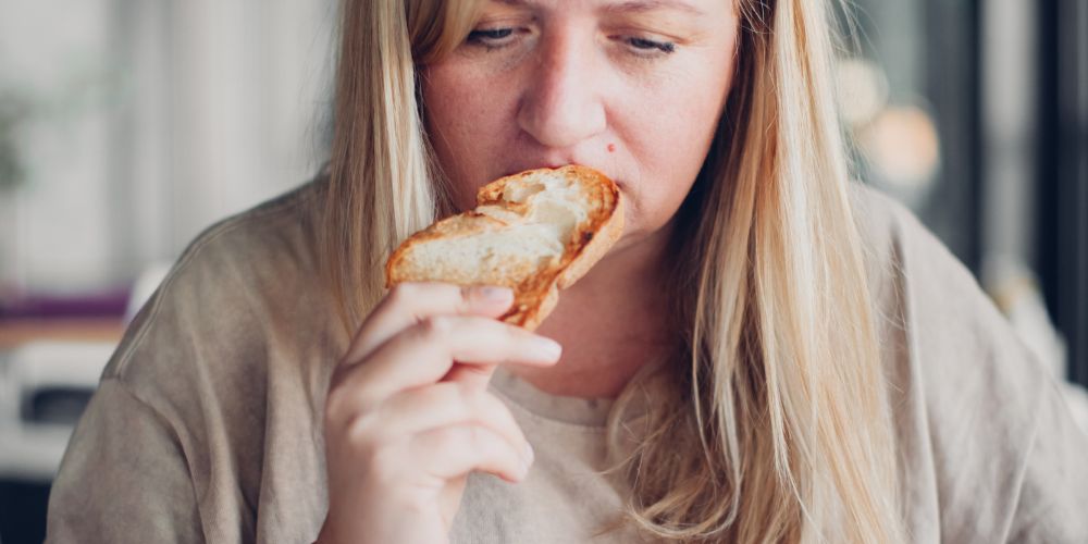 Upset-woman-dealing-negative-emotions-stress-eating.jpg