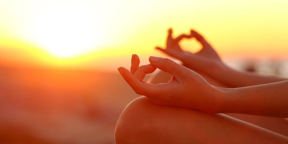 Woman yoga exercise sunset