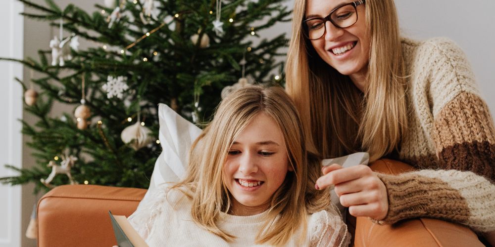 Women Couch Christmas Tree Book