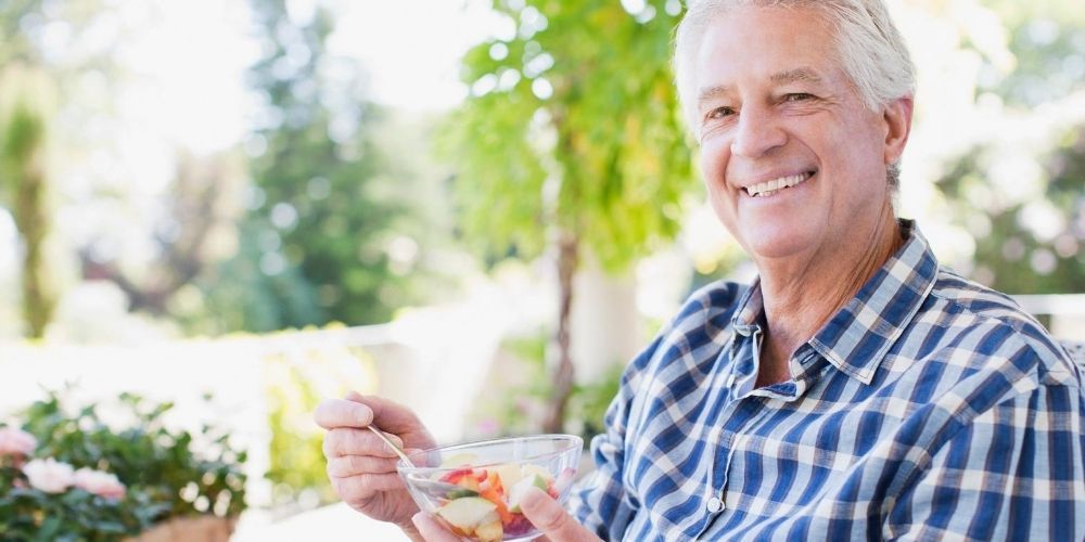 man eating vegetable